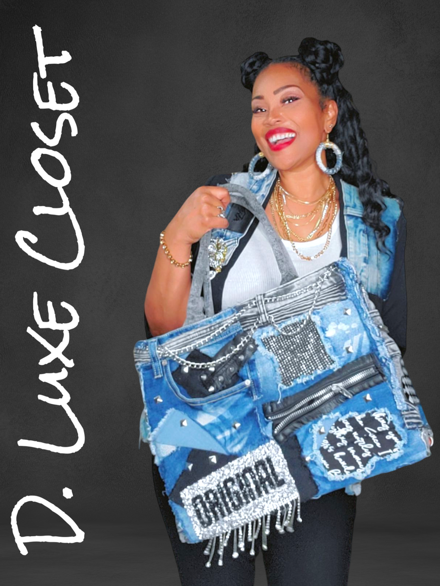 Woman holding a decorative denim bag with 'D. Luxe Closet' branding on a dark background